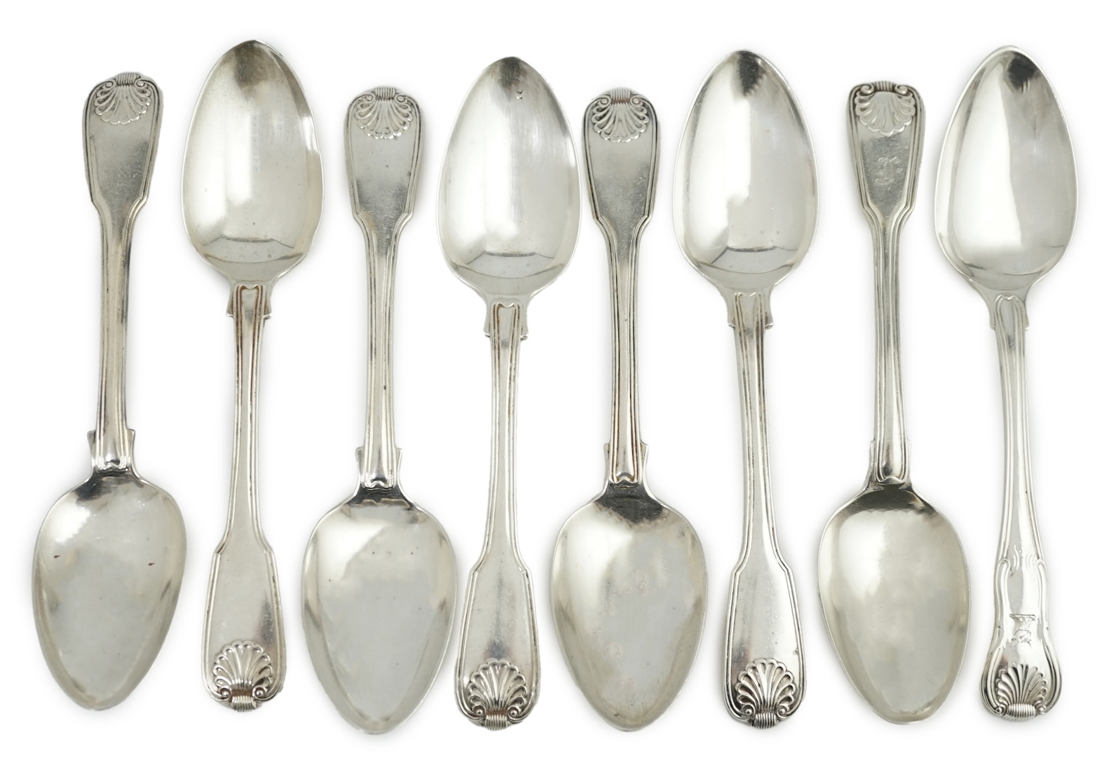 A set of seven George IV silver fiddle, thread and shell pattern dessert spoons, by Francis Higgins II, London, 1826 and another 1789